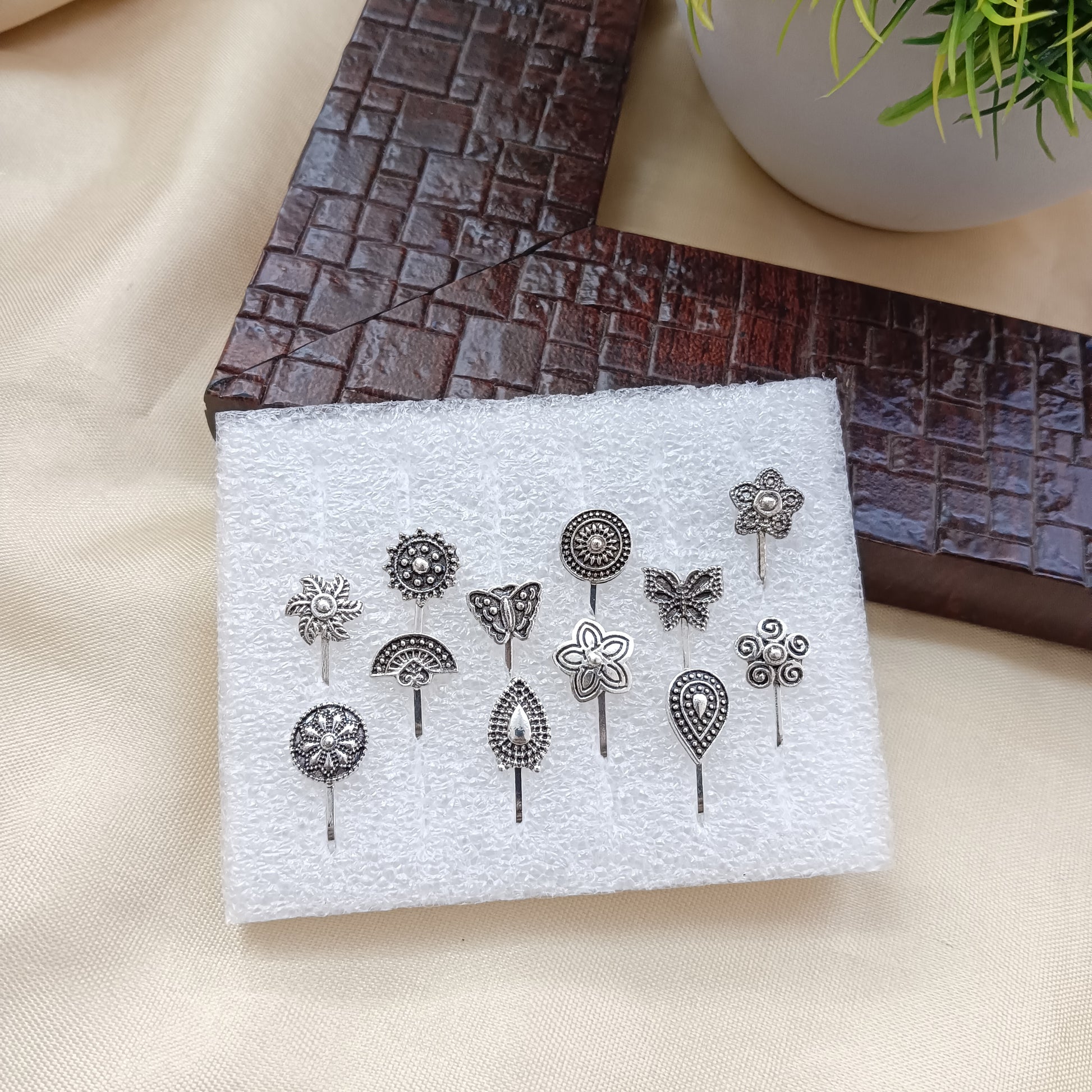 The99Jewel Set Of 12 Assorted Design Oxidised Plated Nose Pin Combo