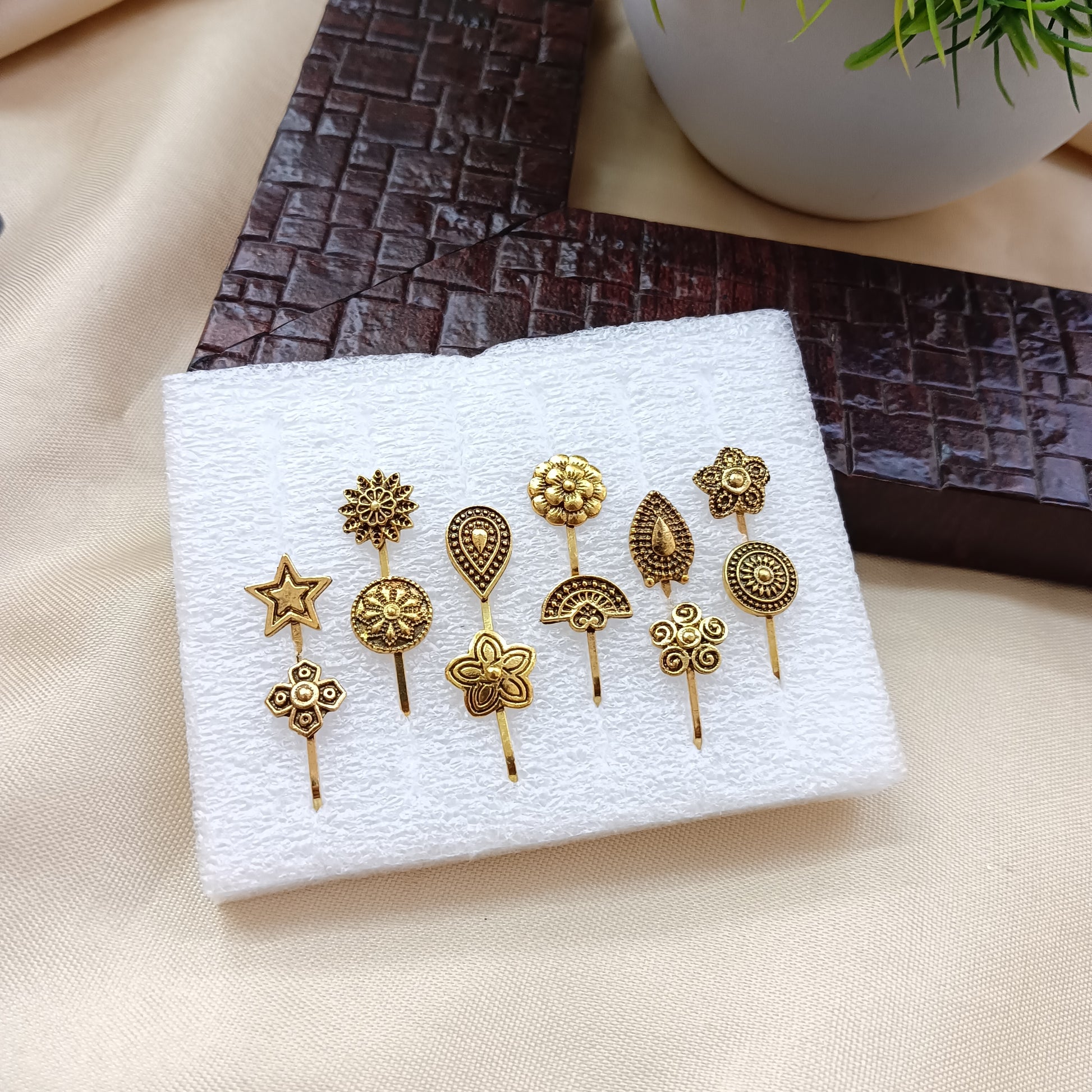 The99Jewel Set Of 12 Assorted Design Gold Plated Nose Pin Combo