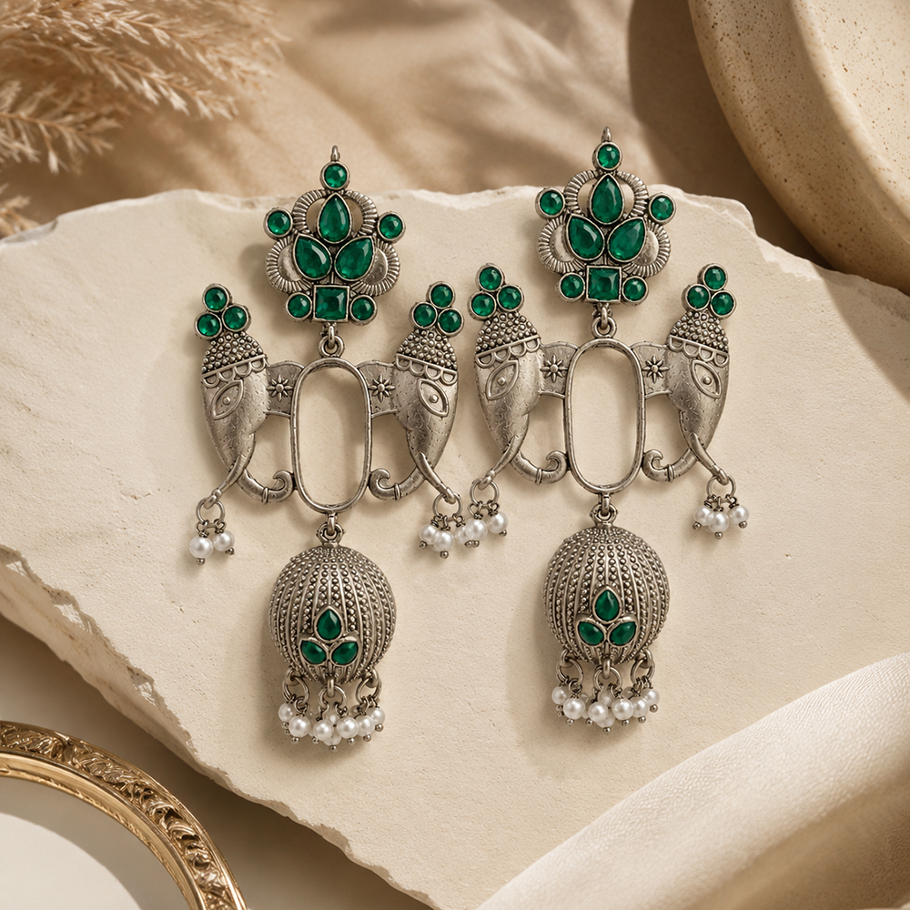 The99Jewel Oxidized Silver Elephant Motif Jhumka Earrings with Green Stones & Pearl Drops