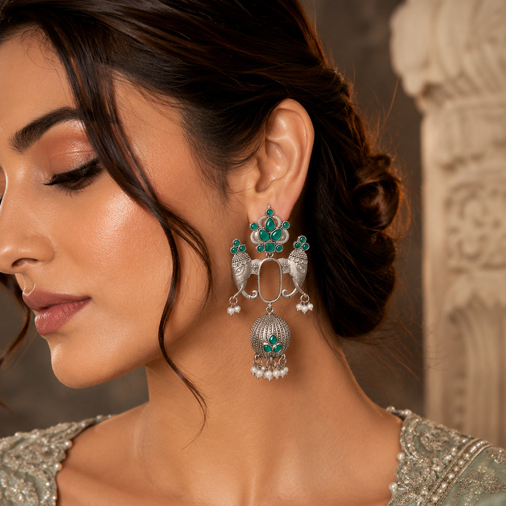 The99Jewel Oxidized Silver Elephant Motif Jhumka Earrings with Green Stones & Pearl Drops