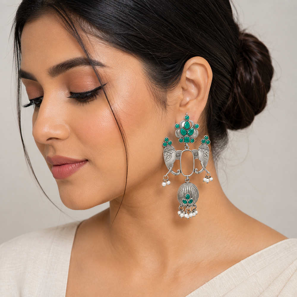 The99Jewel Oxidized Silver Elephant Motif Jhumka Earrings with Green Stones & Pearl Drops