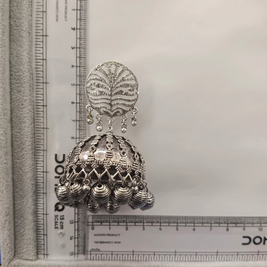The99Jewel These oxidised silver jhumka earrings feature a floral stud for Women