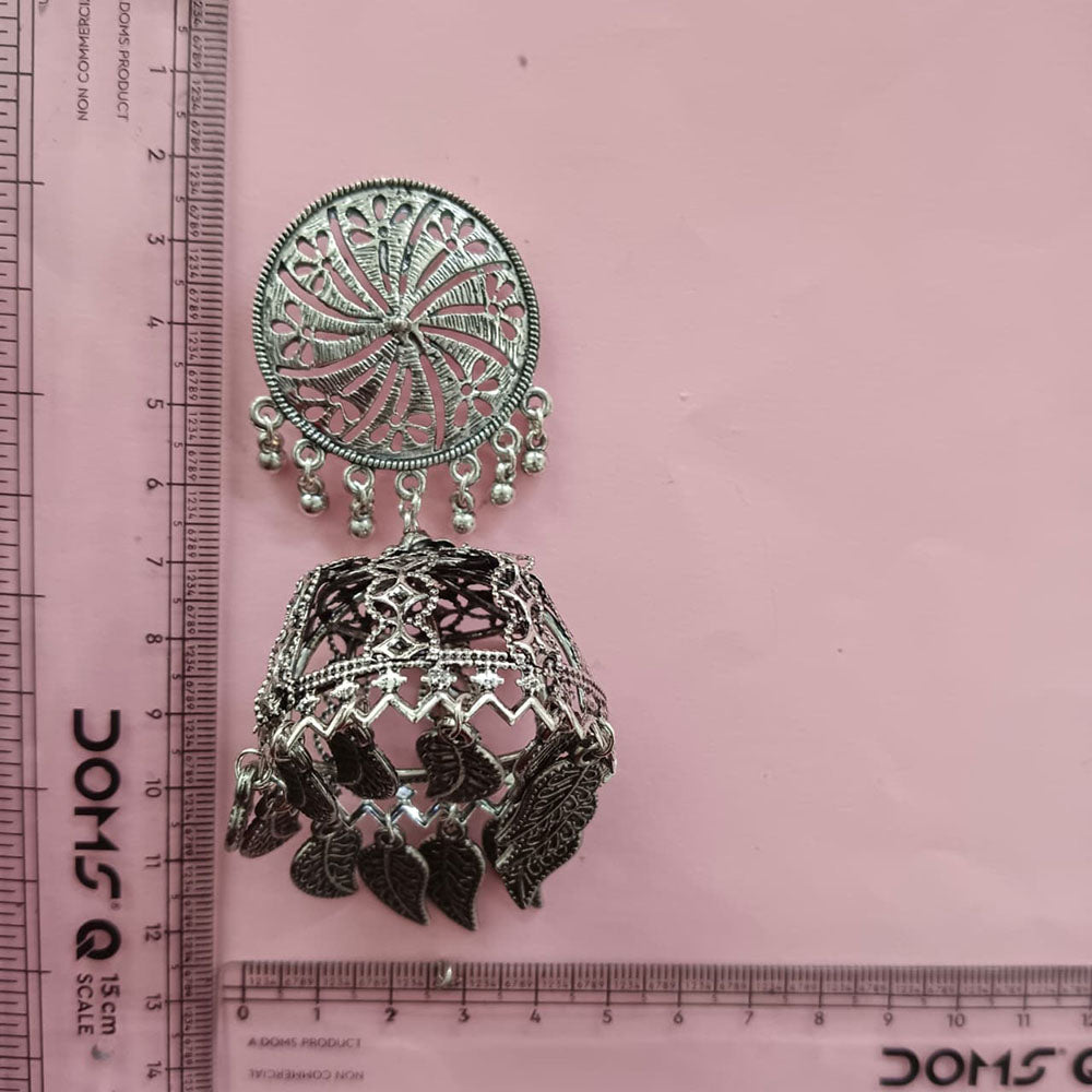The99Jewel These oxidised silver jhumka earrings feature a floral stud for Women