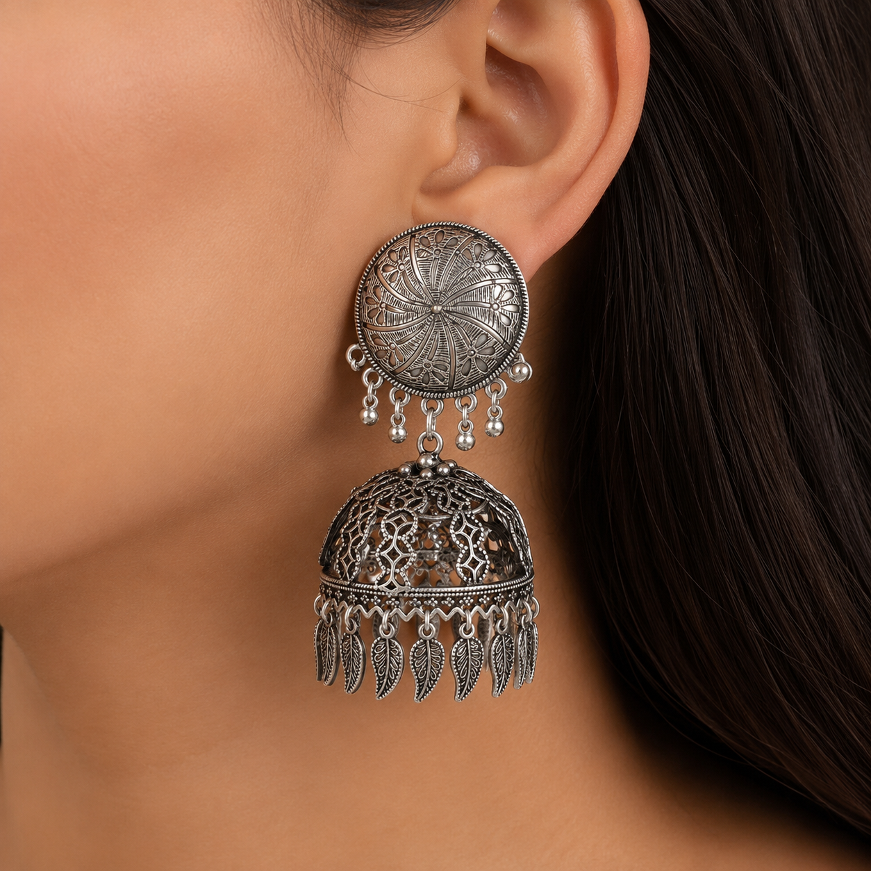 The99Jewel These oxidised silver jhumka earrings feature a floral stud for Women
