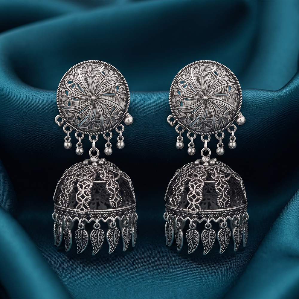 The99Jewel These oxidised silver jhumka earrings feature a floral stud for Women