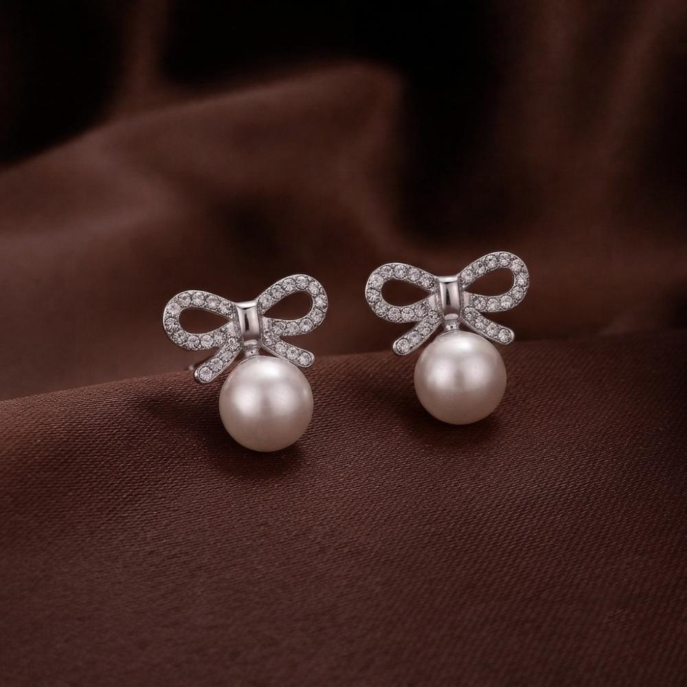The99Jewel Silver Plated Bow Shape Austrian Stone & Pearl Stud Earrings for Women 