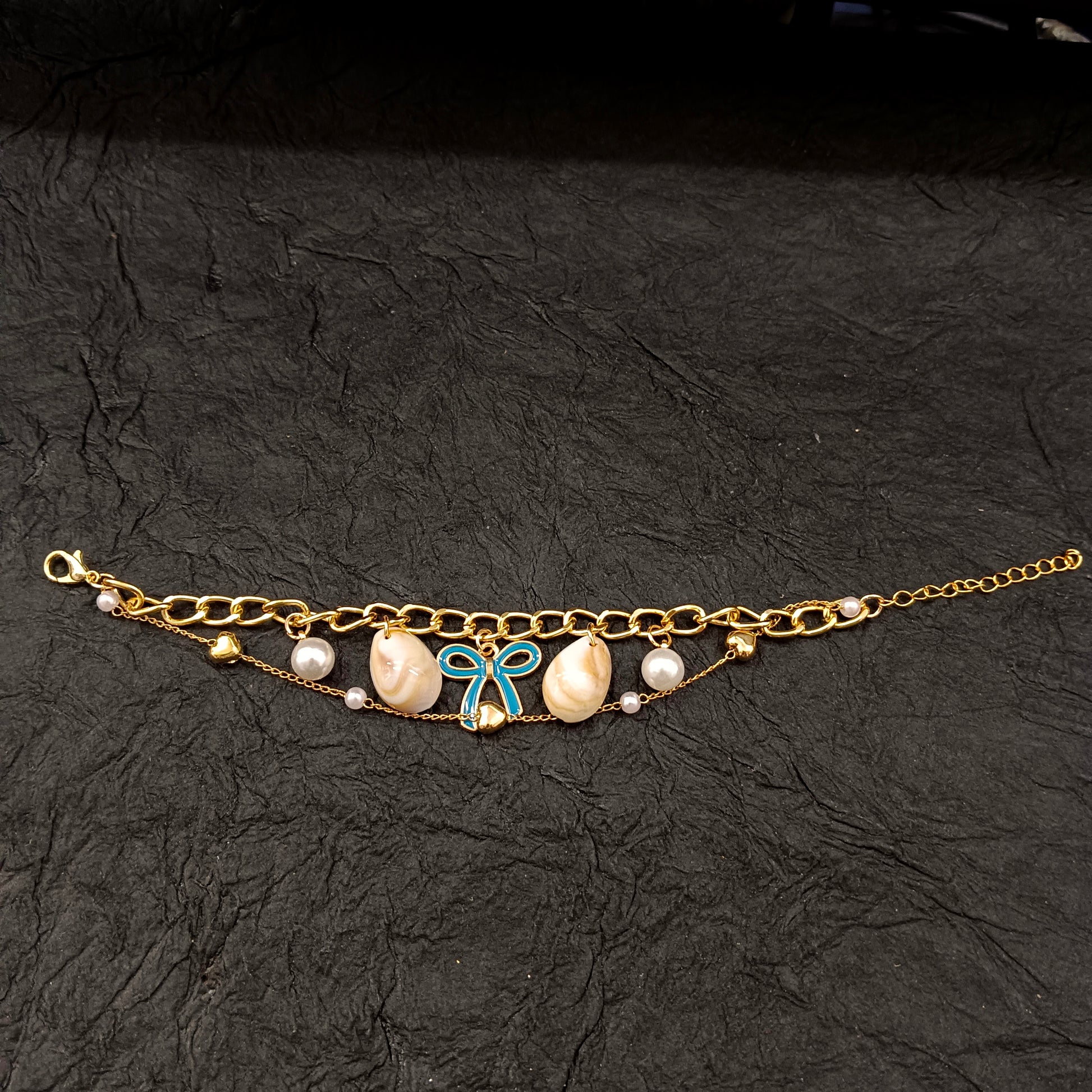 The99Jewel Gold Plated Light Blue Bow And Shell Stylish Bracelets
