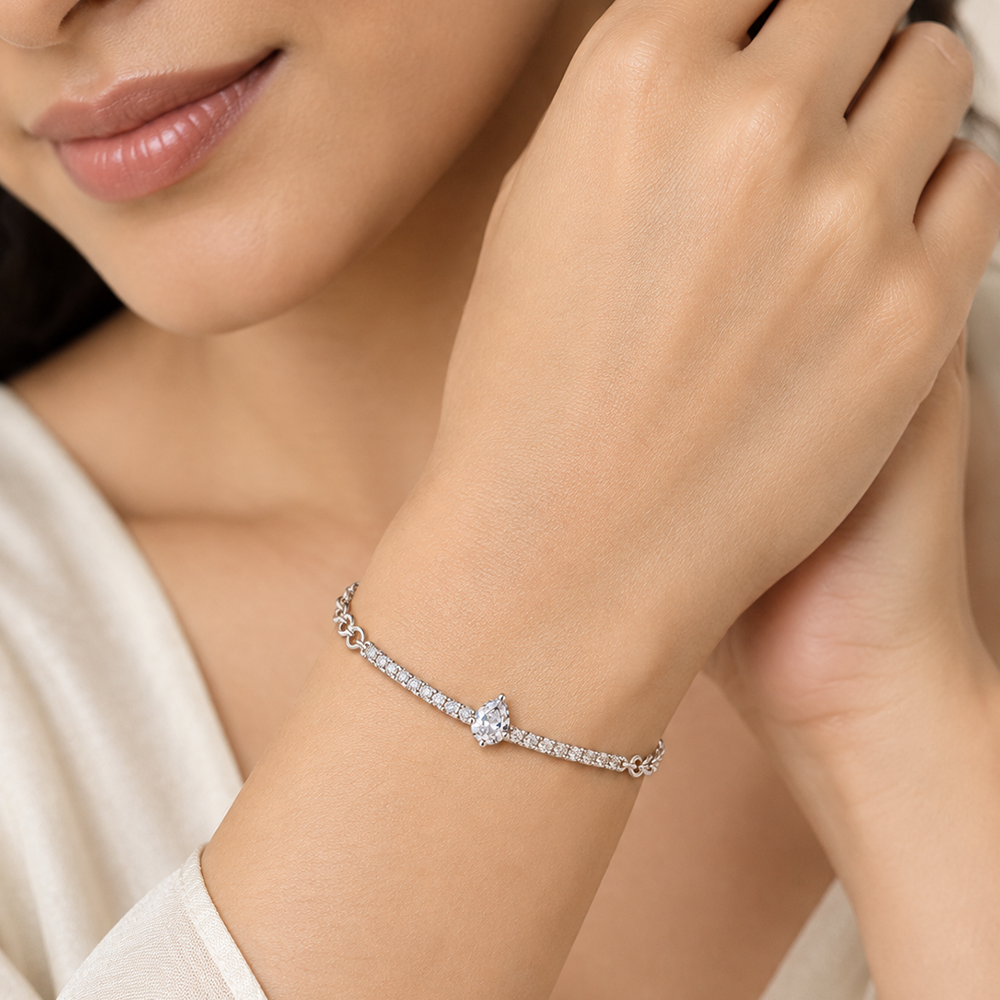 The99Jewel Everglow Silver Plated Tear Drop Shape American Diamond Fashion Bracelet for Women